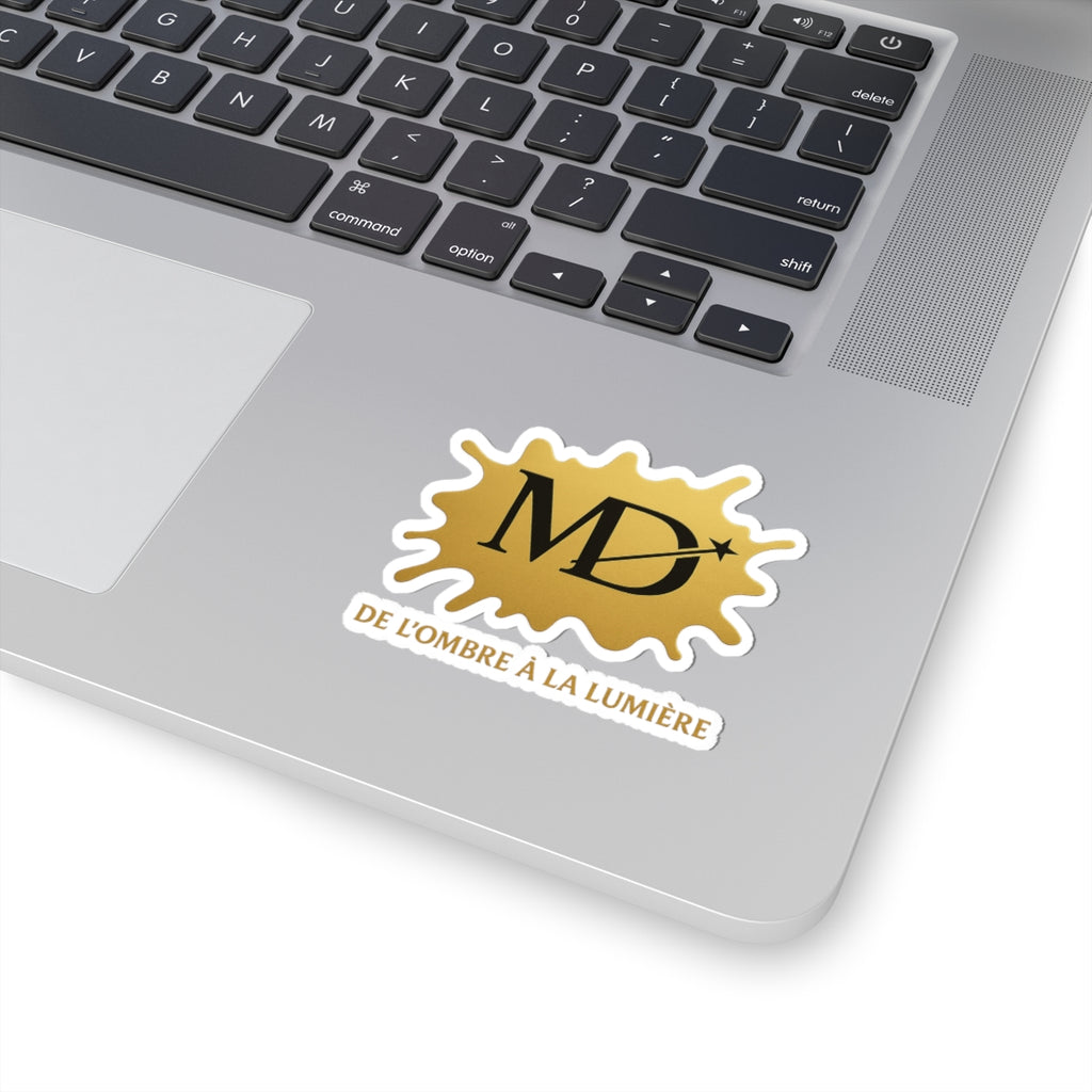 Gold MD Logo Kiss-Cut Sticker — “De l'ombre à la lumière” Laptop Decal
